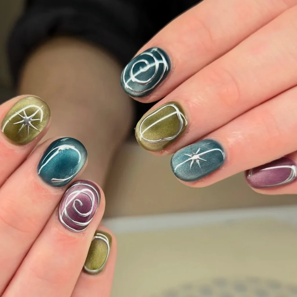  Cat Eye Jewel Tone Nails with Silver Swirl and Star Art