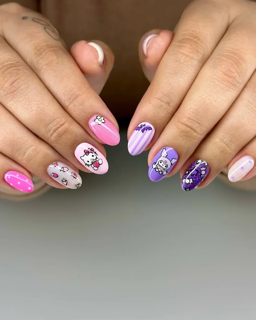 Hello Kitty and Kuromi nails mixing a pink hand with strawberries and dots and a purple hand with bats, stars, and skulls on short almond nails