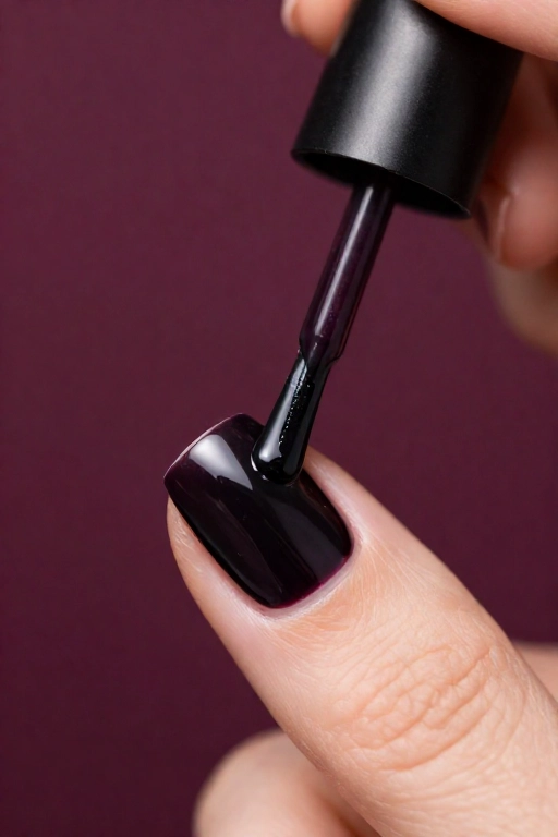 three stroke method applying dark polish with a clean cuticle gap